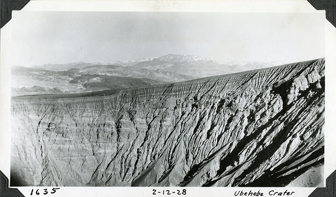 Ubehebe Crater wall and rim looking northeast with mountains in background. February 12, 1928. Photographed by Mat Roy Thompson. (3e778b85-8370-44de-8d17-5b53bfa84627).jpg